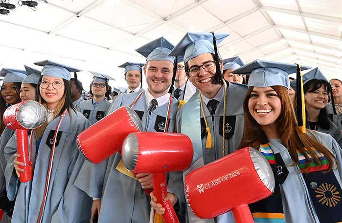School of Engineering and Applied Sciences students hold their hammers. 