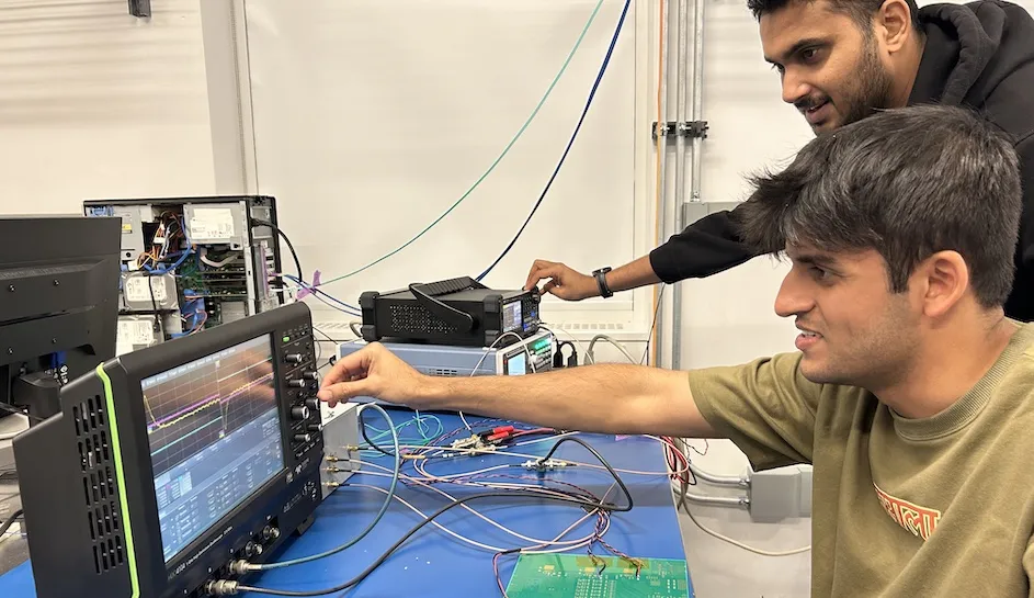 Columbia physics postdoctoral researcher Akshay Malige and physics PhD student Svanik Tandon work on pGRAMS electronics at Columbia's Nevis Laboratories.