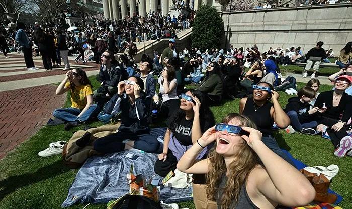 Students look up at the eclipse