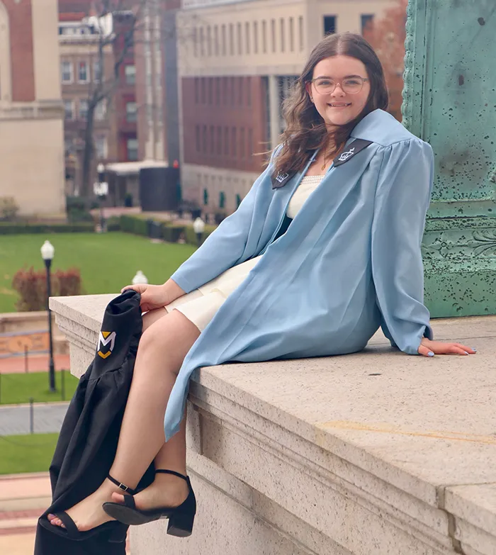 Heather Binion poses on Columbia’s campus for graduation