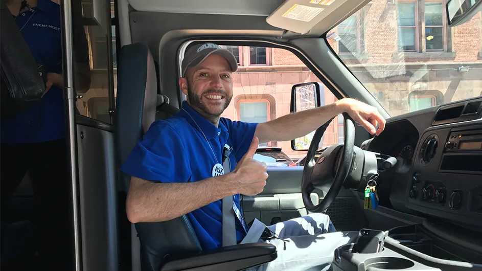 Dan Allalemdjian, circa 2017, behind the wheel of Columbia’s Commencement shuttle. 