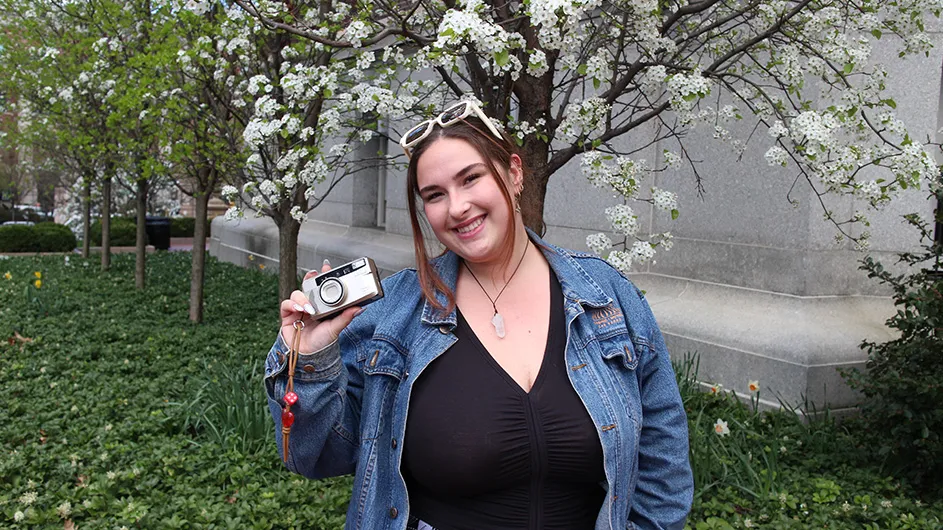 Erin Frank with her camera in hand on Columbia’s Morningside campus. ‘90s