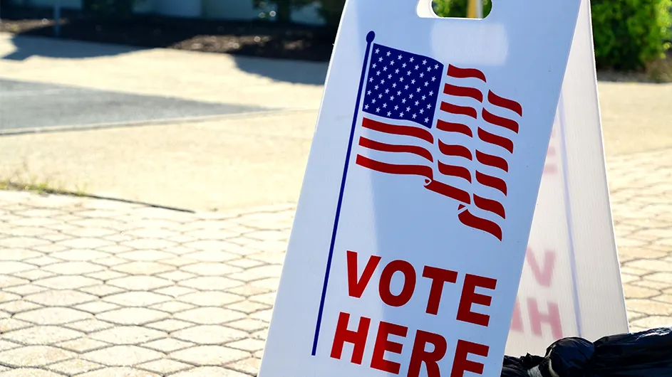 a vote here sandwich board
